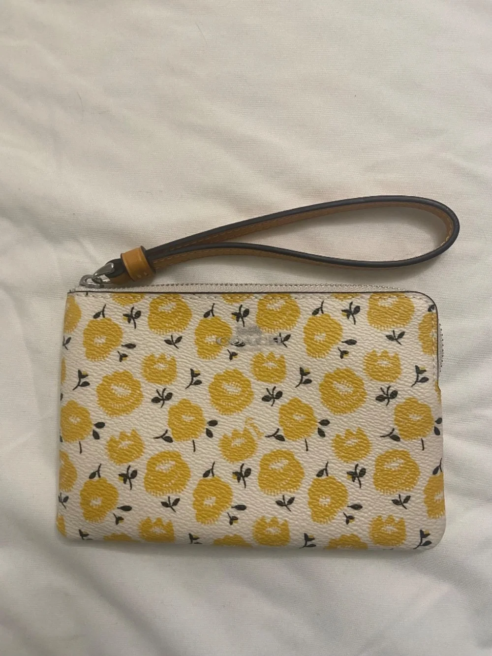 Coach wristlet with floral print